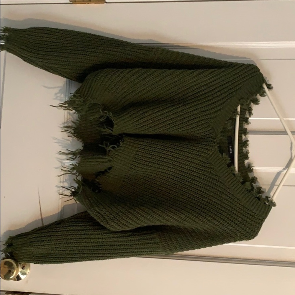 Women’s loose ripped V neck sweater